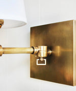 Load image into Gallery viewer, Pair Pivoting Wall Sconces in Antique Brass Finish with Linen Shades

